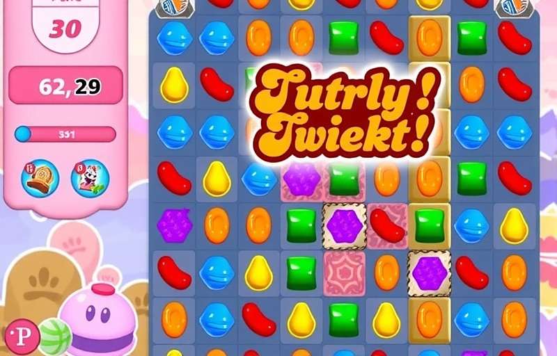 Candy Crush Saga India gameplay showing Indian sweets like gulab jamun and jalebi as game pieces